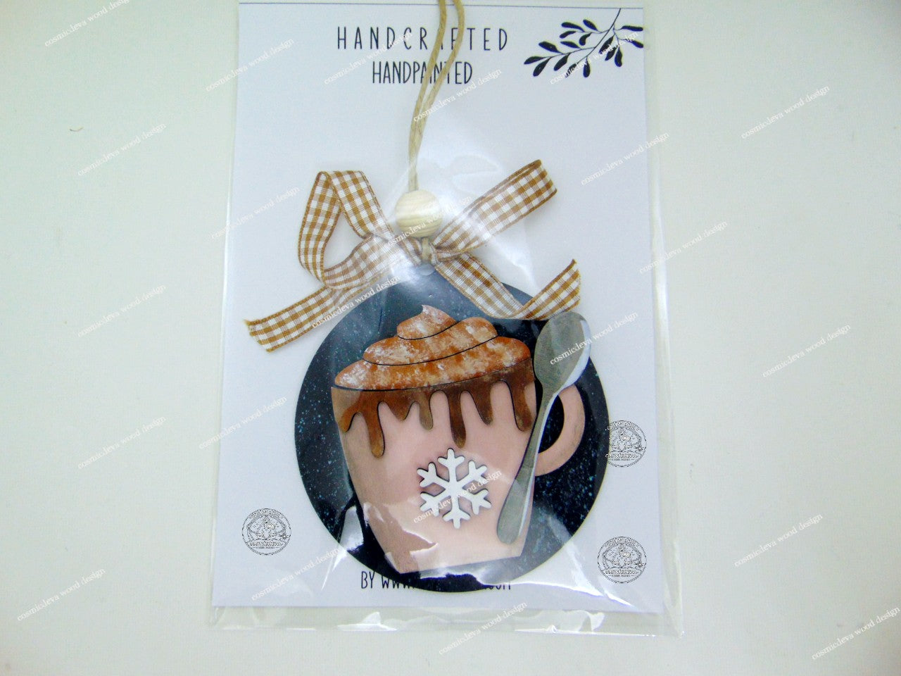 Warm up your tree with this hand-painted Rose Hot Cocoa Mug Wood Ornament. Featuring a snowflake design and rustic twine, it’s the perfect cozy holiday gift!
