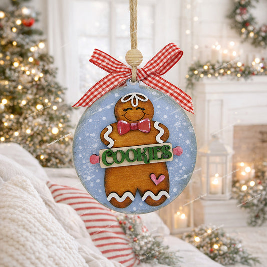 Hand painted wooden gingerbread man Christmas ornament with rolling pin “Cookies” cut out, blue sprinkle background, jute twine, wood bead, and checkered bow. Cute handmade holiday décor for bakers and cookie lovers.