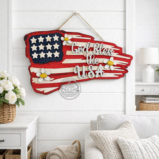 Handmade rustic American flag wall sign with layered laser-cut wood, distressed paint, and raised “God Bless the USA” lettering. Patriotic farmhouse décor perfect for July 4th or gifting.