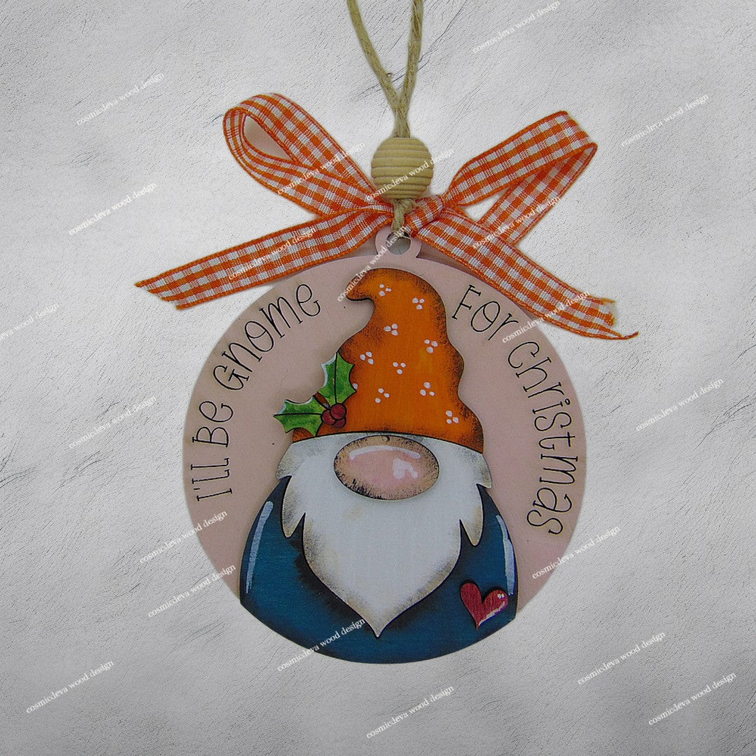 Handmade hand painted gnome Christmas ornament with engraved “I’ll Be Gnome for Christmas” text. Layered Baltic birch wood, rustic jute twine, wood bead, and bow. Cute holiday décor or gift.