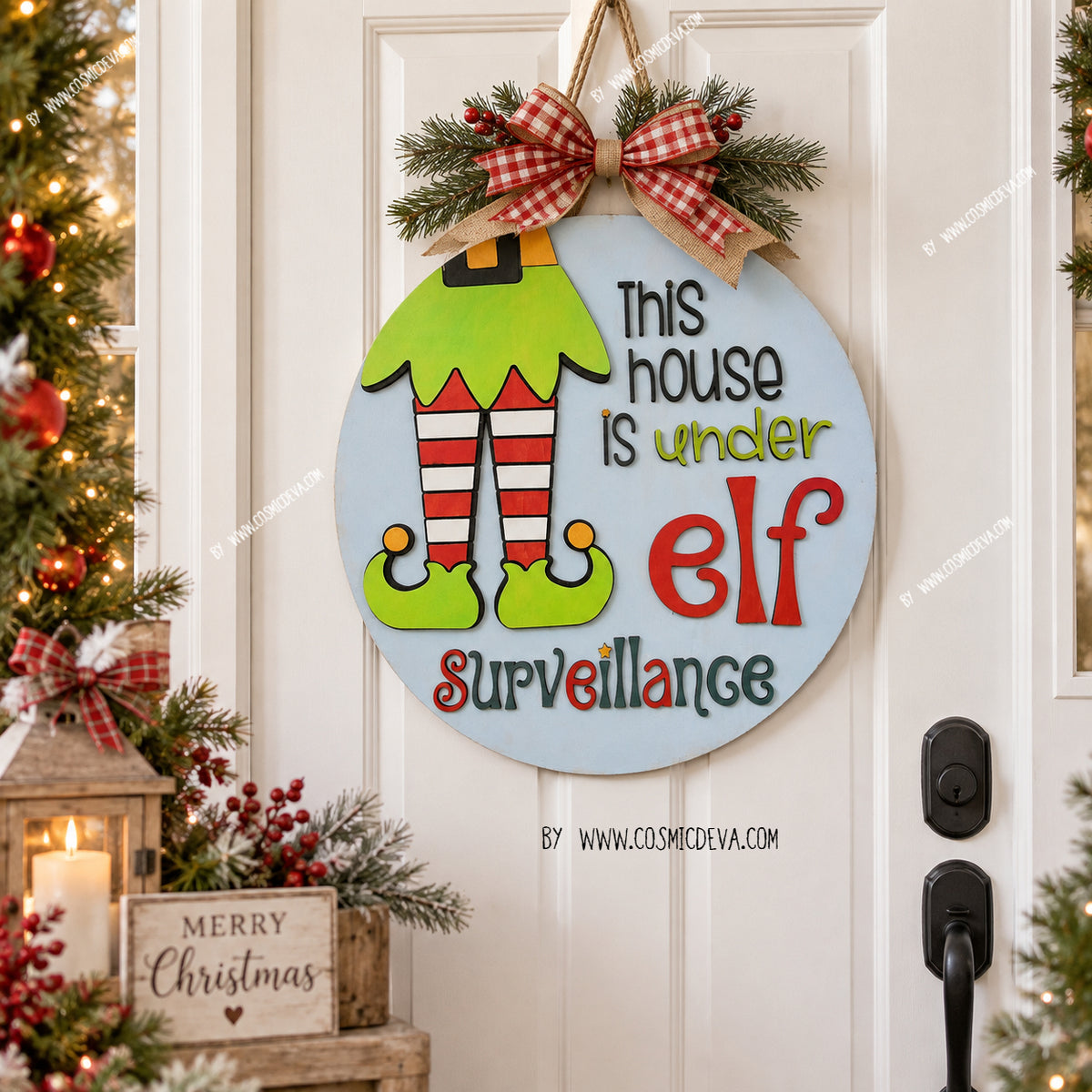 Handmade Elf Christmas door hanger featuring “This House Is Under Elf Surveillance.” Layered 3D wood sign in 12" or 14", hand painted in Alabama. By cosmicdeva