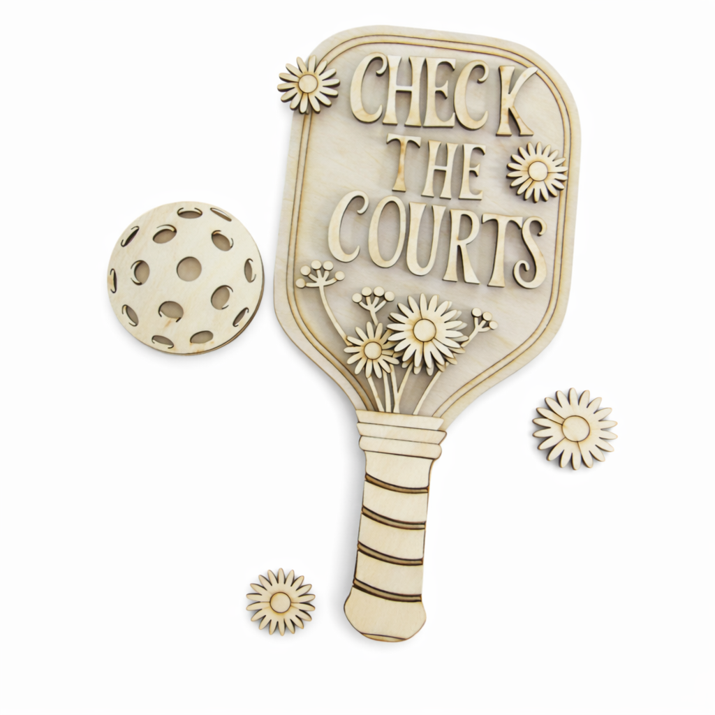 Bring pickleball charm into your home with this hand painted wooden pickleball paddle wall sign, featuring 3D floral details and the cut out phrase “Check the Courts.” Available finished or as a DIY craft kit, this lightweight 3mm laser cut paddle makes the perfect wall hanger for pickleball obsessed fans, players, and gift givers.