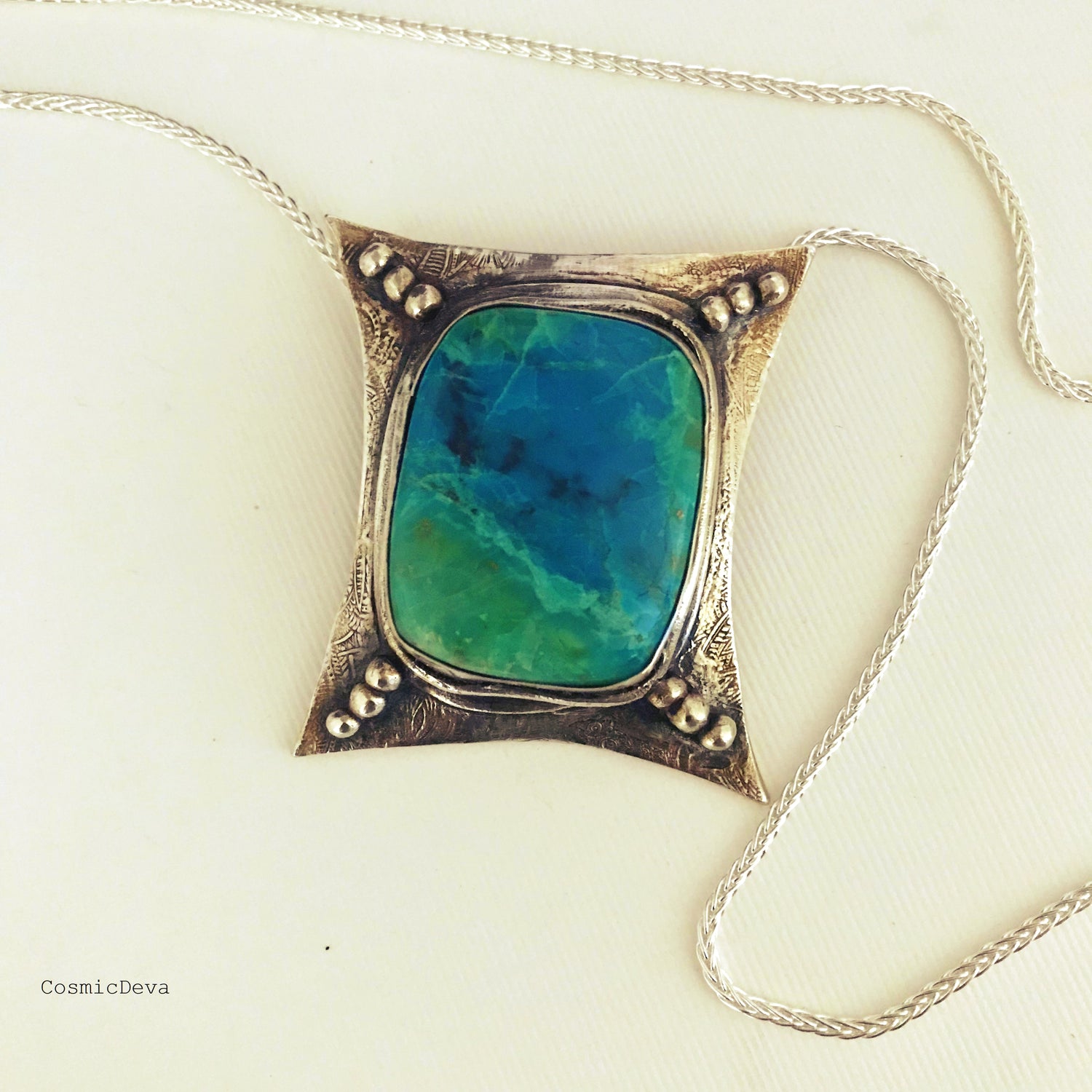 One of a kind fully handmade sterling silver art jewelry necklace with a spectacular vibrant blue green Chrysocolla (a.k.a "Peruvian Turquoise") stone.
