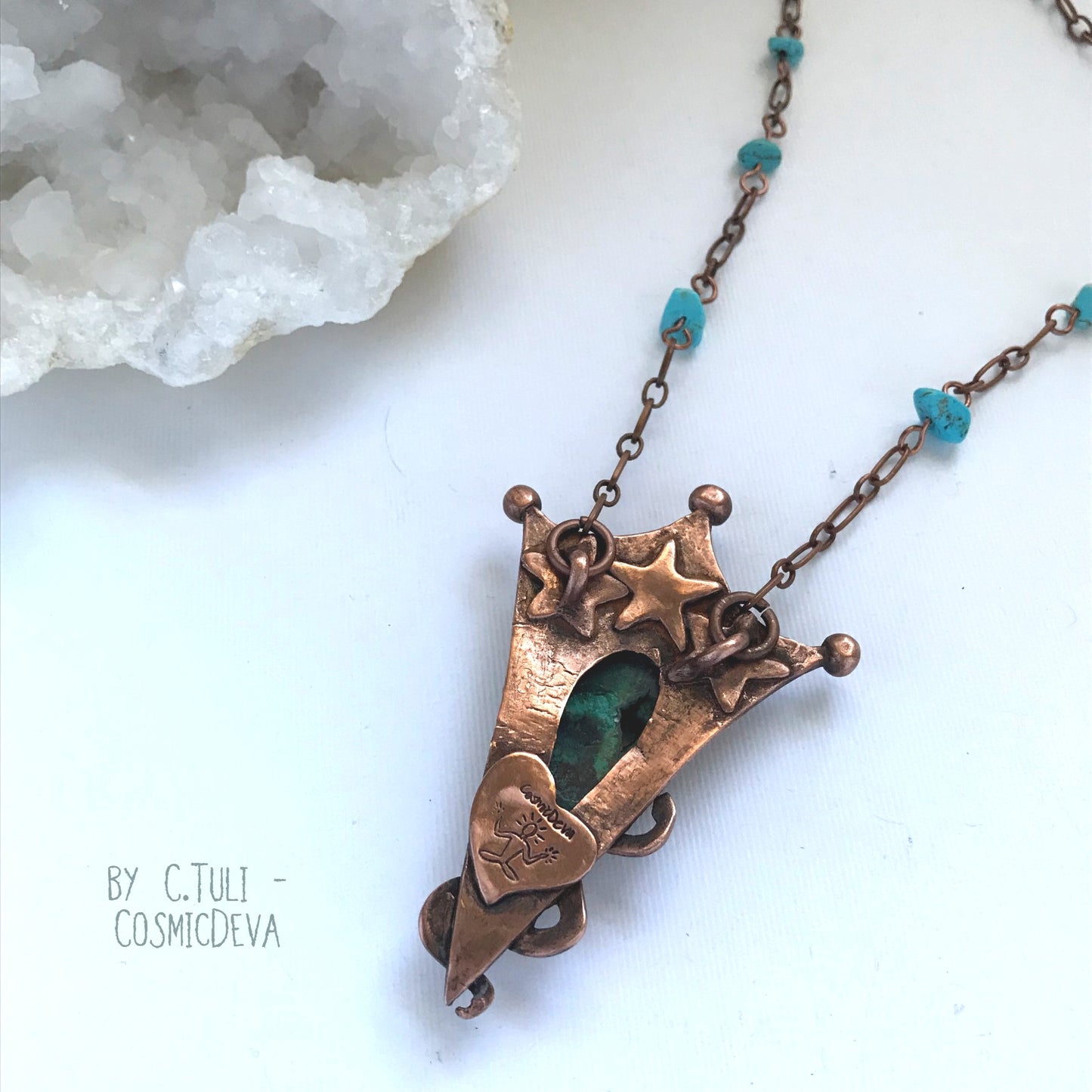 Botryoidal Chrysocolla Copper Snake Pendant Necklace This unique Chrysocolla with Malachite and traces of cuprite gemstone is nestled amidst a complete hand sculptured triangle pendant with a little snake winding up in rich and warm glowing copper and has beautiful swirl texture. This rustic copper statement necklace suspends from a copper chain with natural turquoise beads. The copper jewelry piece was oxidized for a deep warm finish.- CosmicDeva