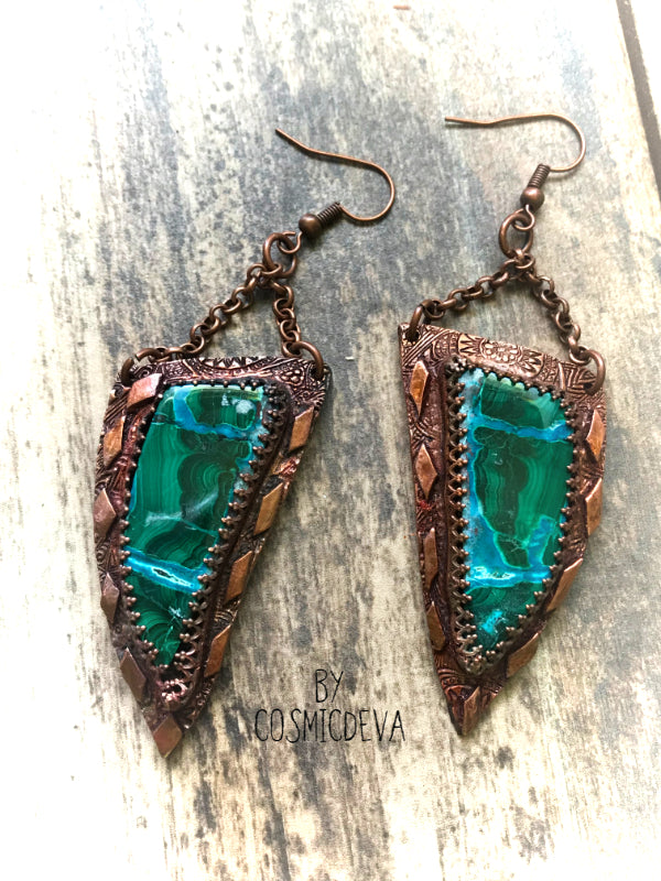 Malachite Chrysocolla One Of A Kind Copper Dangle Earrings, An exquisite and fabulous, matched handmade pair of natural stone Chrysocolla Malachite gemstones make for an unforgettable pair of dangle earrings. I have set these beautiful stones in textured and oxidized solid red copper reminiscent of ancient times. These fantastic earrings have a combination of gem silica chrysocolla and malachite. Amazing blue and green colors in a striking pattern. These are rare and hard to find stones.- CosmicDeva