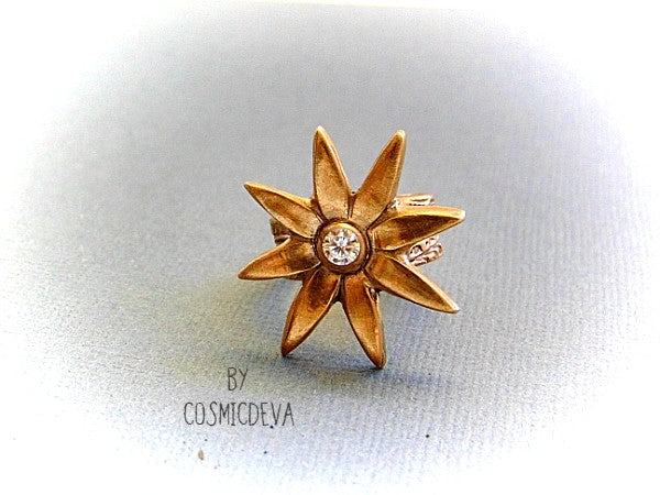 Add some sparkle to your life with this beautiful Flower Cocktail Ring! Handcrafted with a solid gold bronze setting and a dazzling cubic zirconia gemstone, this statement ring will make your look shine! Upgrade your wardrobe - and your confidence - today!  - CosmicDeva