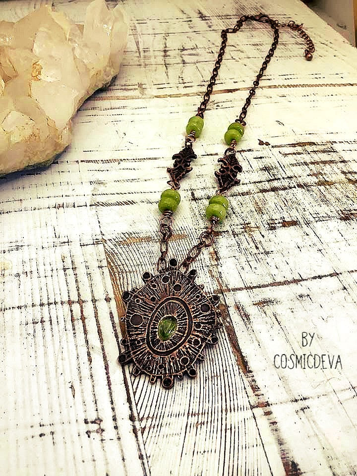 Draw attention with this unique one-of-a-kind handmade copper pendant necklace, featuring a stunning peridot gemstone at its center. Oxidized for a warm, deep finish and suspended by light olive-green jade beads, it's a magnificent piece of art that will add a special touch of glamour to any occasion. Wear it and make an unforgettable impression!. - CosmicDeva
