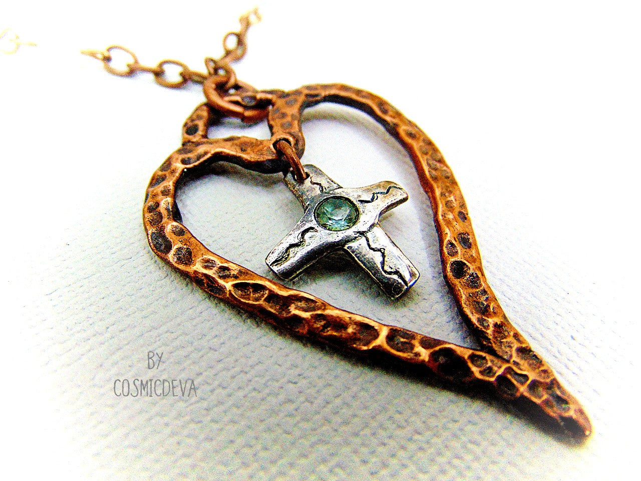 For The Love Of God - Express your faith in style and show your love for God with this beautiful handmade copper heart and sterling silver cross necklace, featuring an exquisite light blue topaz in the center. The deep warm finish and accentual aura white facetted Czech glass beads add a charming touch to your most special occasions.