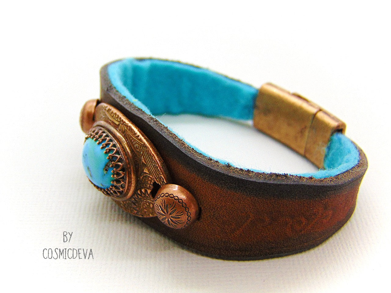 Beautiful one of a kind handcrafted southwestern leather bracelet made of earthy mid-western style brown dyed veg tan leather. The focal point is a natural stabilized Tibet turquoise with a bezel setting in solid copper.