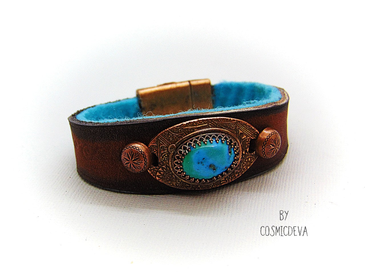 Beautiful one of a kind handcrafted southwestern leather bracelet made of earthy mid-western style brown dyed veg tan leather. The focal point is a natural stabilized Tibet turquoise with a bezel setting in solid copper.