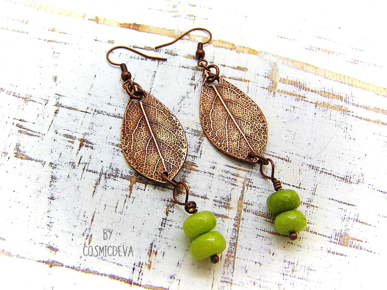 Lovely uniquely handcrafted sage leaf copper earrings featuring apple green dyed jade stone gemstone beads. These botanical copper earrings are made of high-quality materials with attention to details. The metal components were made by me: leaf earrings were crafted from solid copper, uniquely textured and carved and polished to bring out the highlights.  cosmicdeva