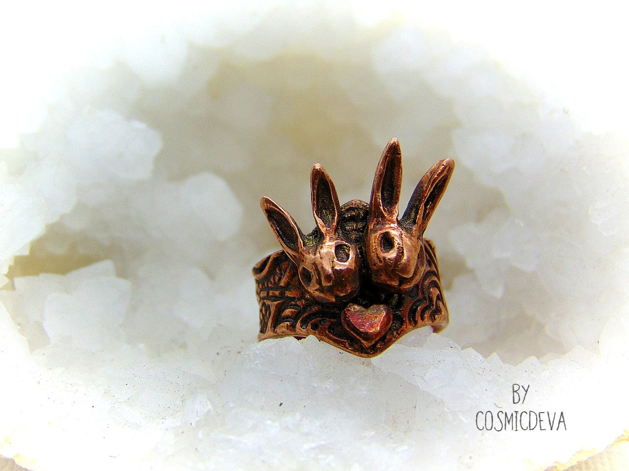 Cute one of a kind handmade unique bunny love Ring made of copper. This lovely ring features two snuggled bunny heads with a little heart in the middle. The ring shank has a beautiful texture and is decorated with another heart on the back side.