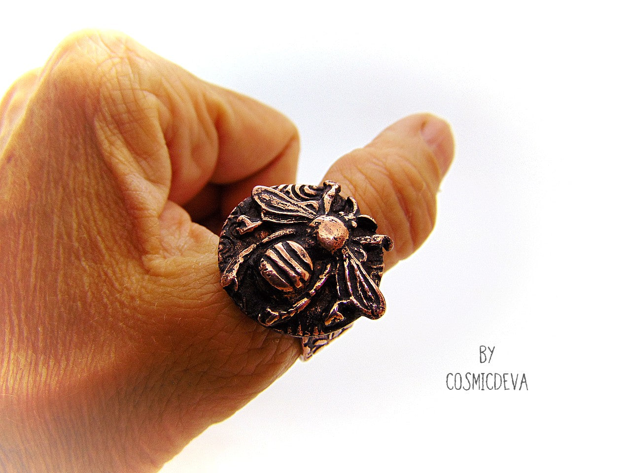 Handmade queen bee goddess, honey bee ring made of solid copper. The ring shank has a beautiful texture and has the cosmicdeva logo inside.