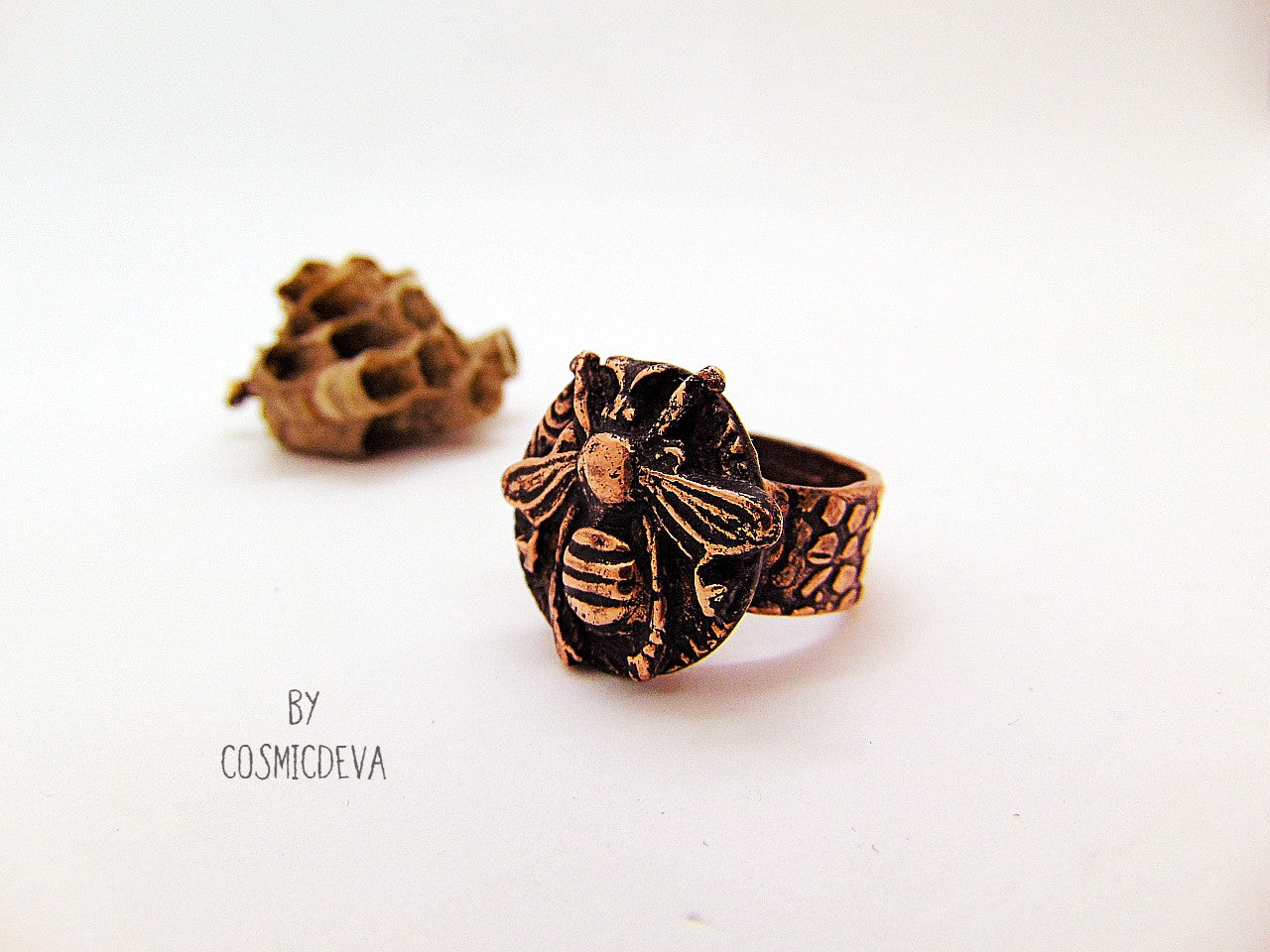 Handmade queen bee goddess, honey bee ring made of solid copper. The ring shank has a beautiful texture and has the cosmicdeva logo inside.