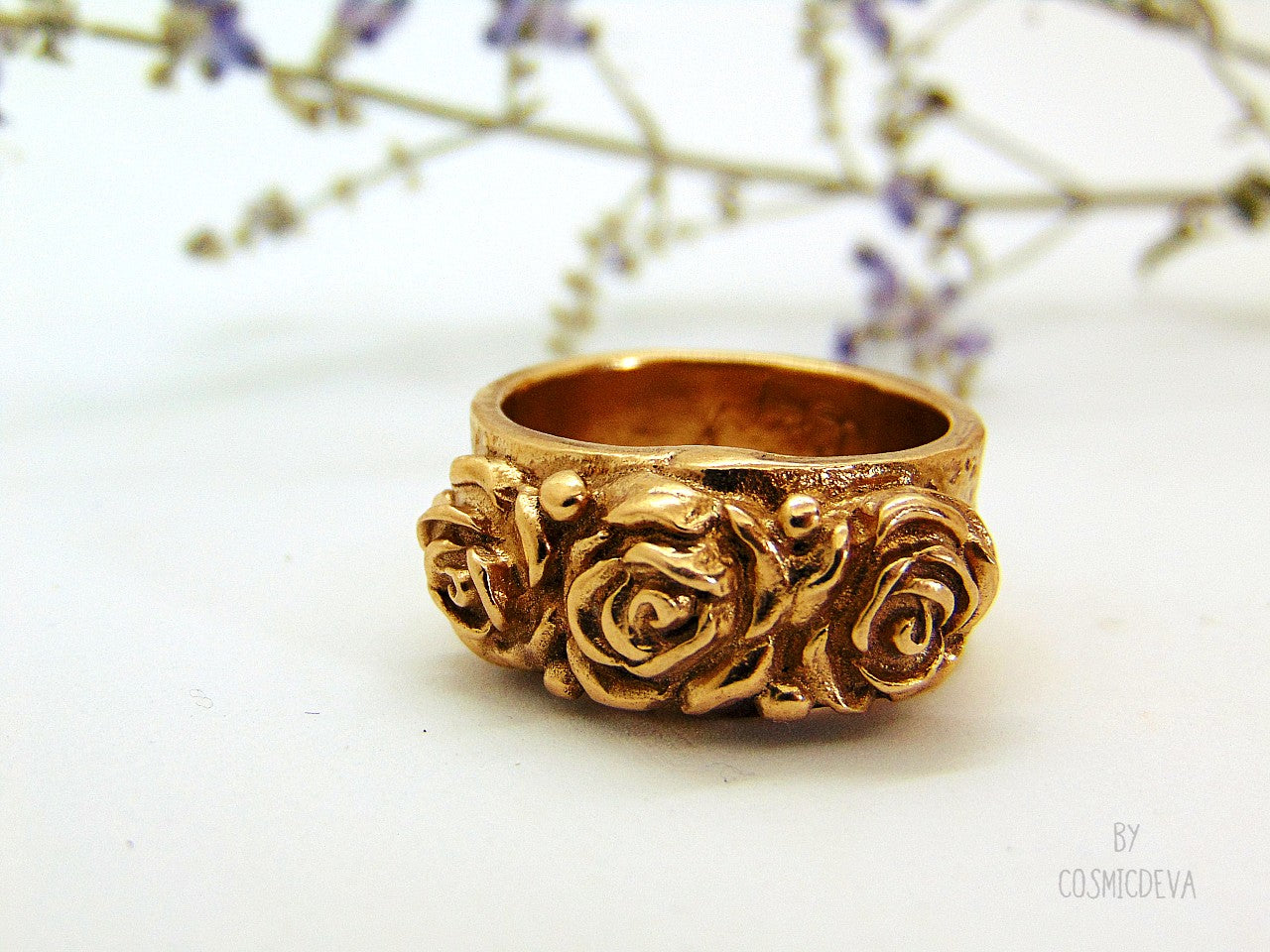 Handmade and hand formed unique organic solid gold bronze roman style ring featuring three roses with two hearts 💕 on the bottom side. This ring is sealed with Renaissance wax and comes with a complimentary polishing cloth. All my jewelry is packed in a beautiful gift box.