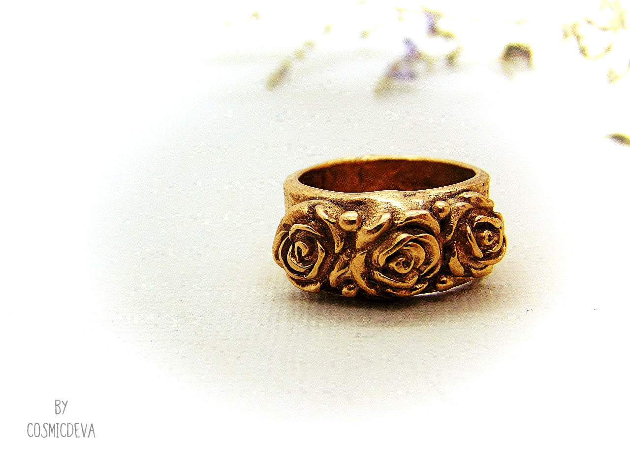 Handmade and hand formed unique organic solid gold bronze roman style ring featuring three roses with two hearts 💕 on the bottom side. This ring is sealed with Renaissance wax and comes with a complimentary polishing cloth. All my jewelry is packed in a beautiful gift box.