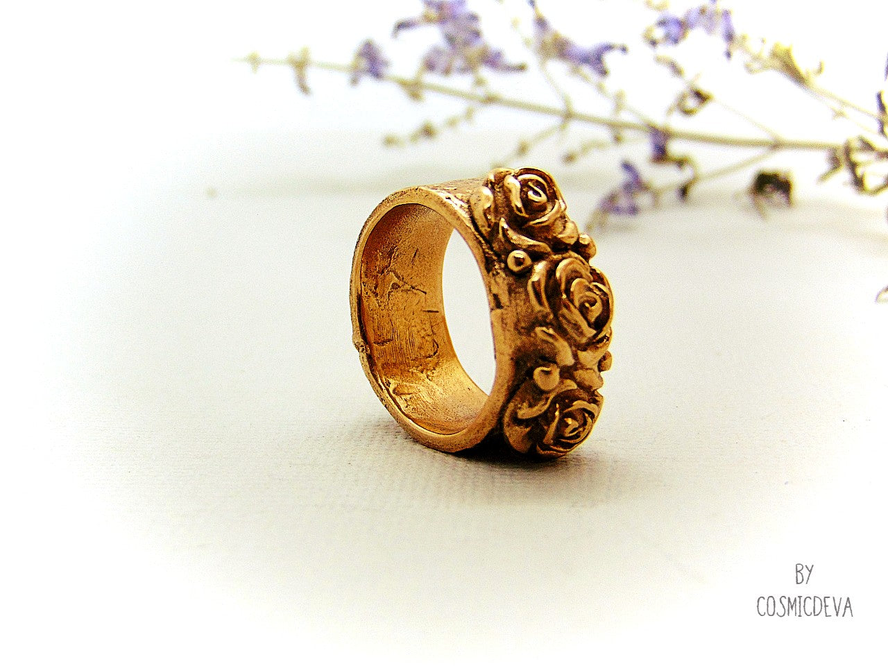 Handmade and hand formed unique organic solid gold bronze roman style ring featuring three roses with two hearts 💕 on the bottom side. This ring is sealed with Renaissance wax and comes with a complimentary polishing cloth. All my jewelry is packed in a beautiful gift box.