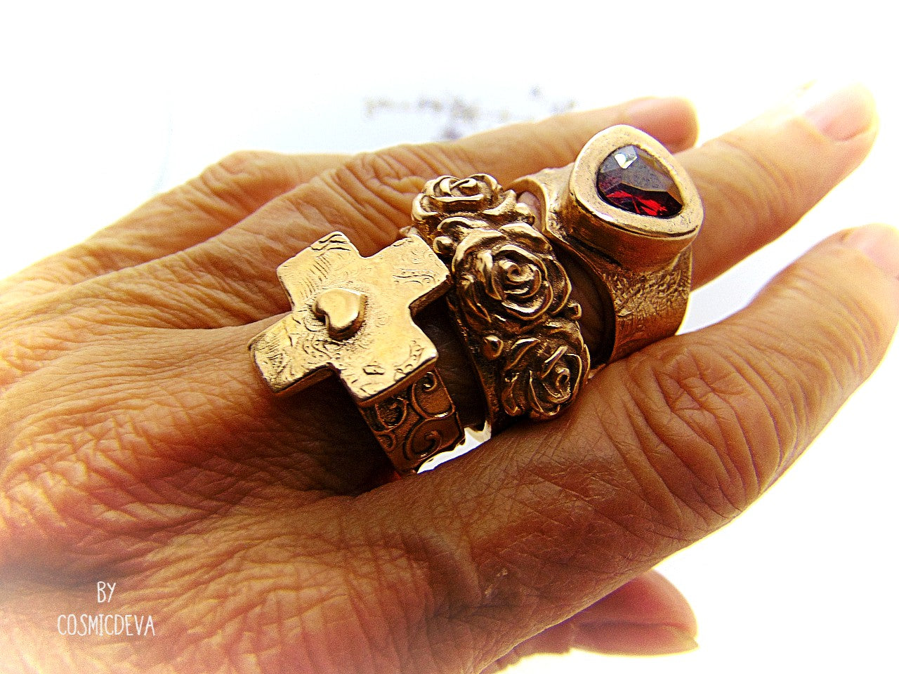 Handmade and hand formed unique organic solid gold bronze roman style ring featuring three roses with two hearts 💕 on the bottom side. This ring is sealed with Renaissance wax and comes with a complimentary polishing cloth. All my jewelry is packed in a beautiful gift box.