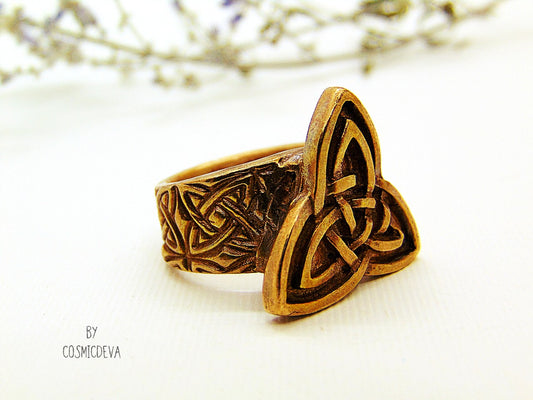 Handcrafted trinity knot ring made of solid gold bronze. The triquetra symbol was adopted by early Irish Christians in the 4th century as a symbol of the Holy Trinity