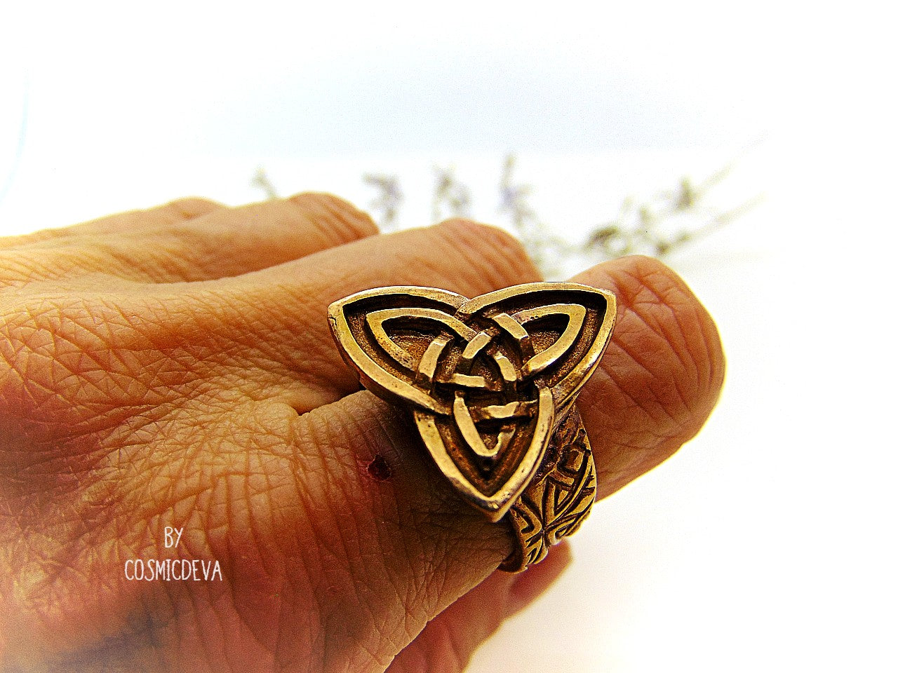 Handcrafted trinity knot ring made of solid gold bronze. The triquetra symbol was adopted by early Irish Christians in the 4th century as a symbol of the Holy Trinity