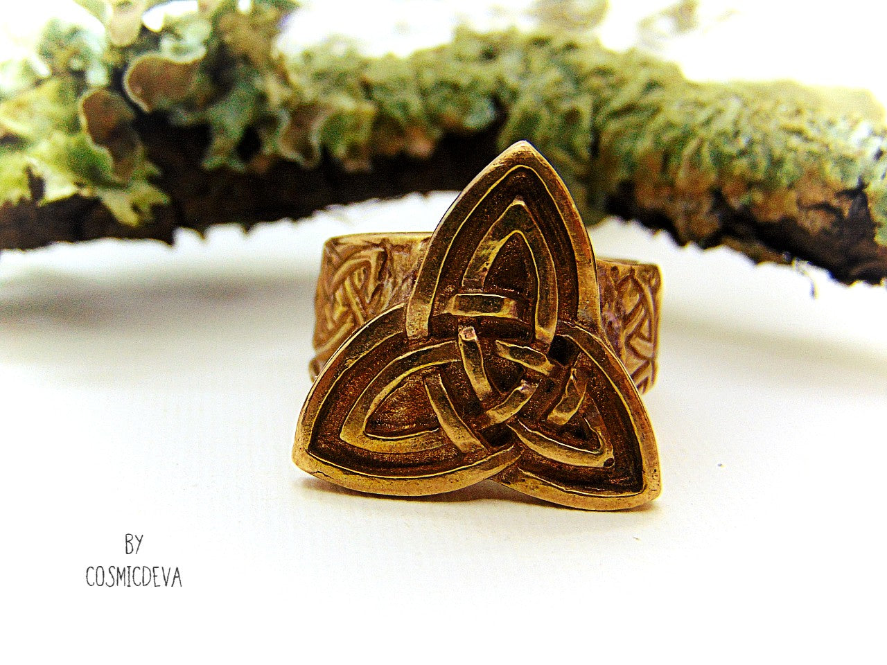 Handcrafted trinity knot ring made of solid gold bronze. The triquetra symbol was adopted by early Irish Christians in the 4th century as a symbol of the Holy Trinity