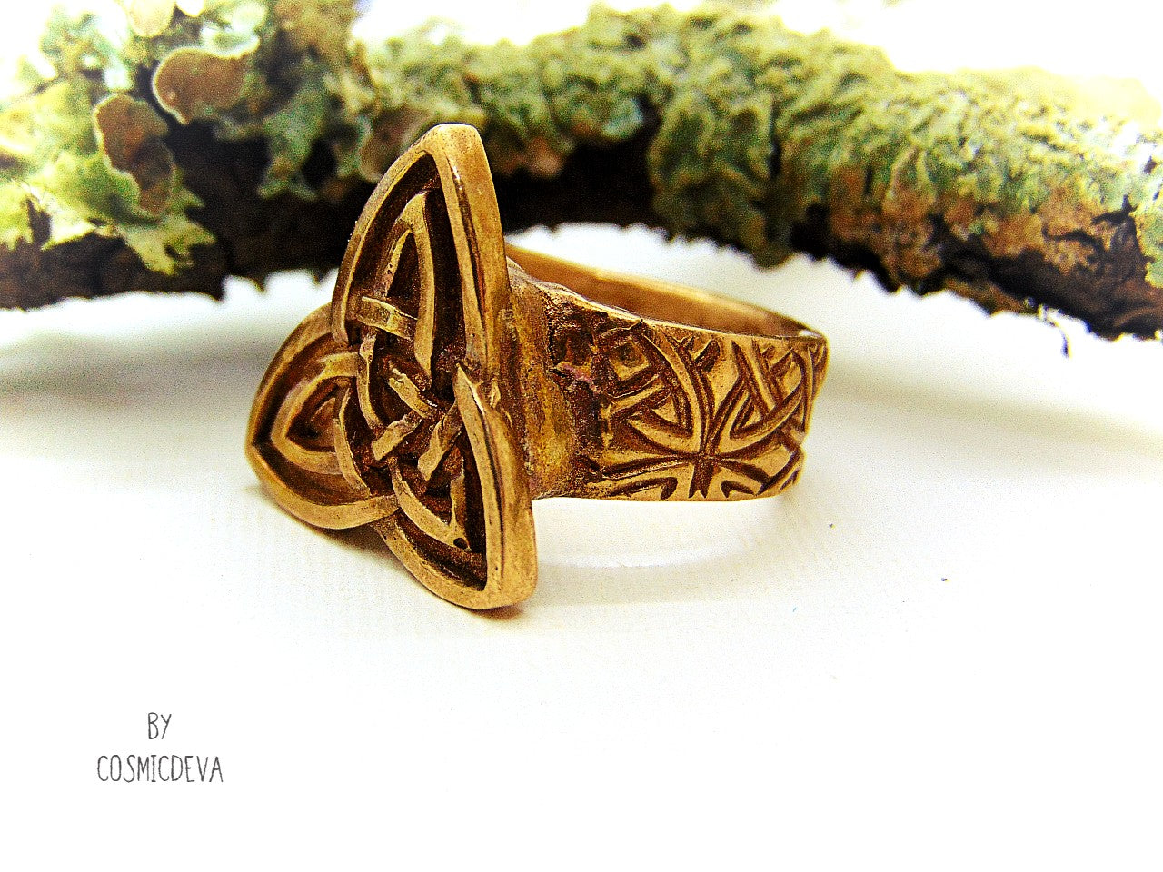 Handcrafted trinity knot ring made of solid gold bronze. The triquetra symbol was adopted by early Irish Christians in the 4th century as a symbol of the Holy Trinity