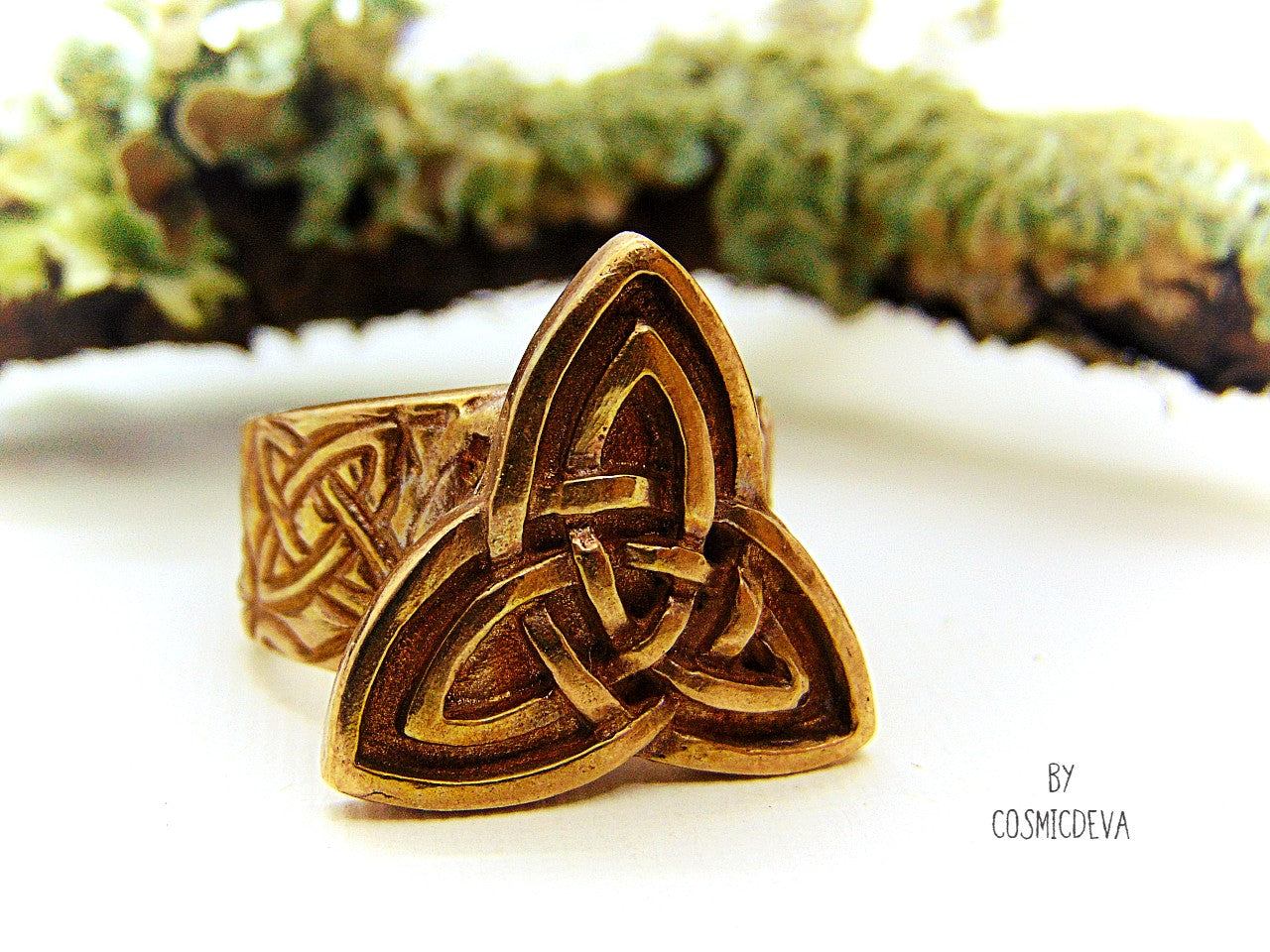 Handcrafted trinity knot ring made of solid gold bronze. The triquetra symbol was adopted by early Irish Christians in the 4th century as a symbol of the Holy Trinity