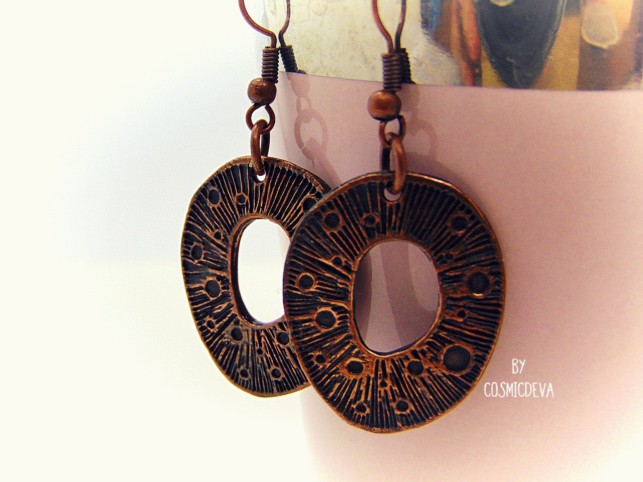 These organic copper dangle earrings are the perfect pick for any season. Handcrafted in the studio, they feature a unique organic texture and warm patinated copper color that can't be found anywhere else. Lightweight and comfortable to wear, no two pairs are ever alike!