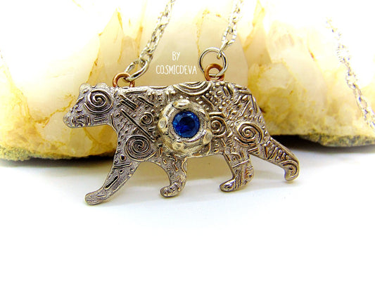 Bring the strength of your spirit animal home with this beautiful handcrafted polar bear pendant! Featuring a 5mm lab-grown blue spinel gemstone and a bronze finish, this necklace is strong and stylish. With a durable adjustable 18-20 inch chain, you can take the comforting power of your spirit animal with you wherever you go!