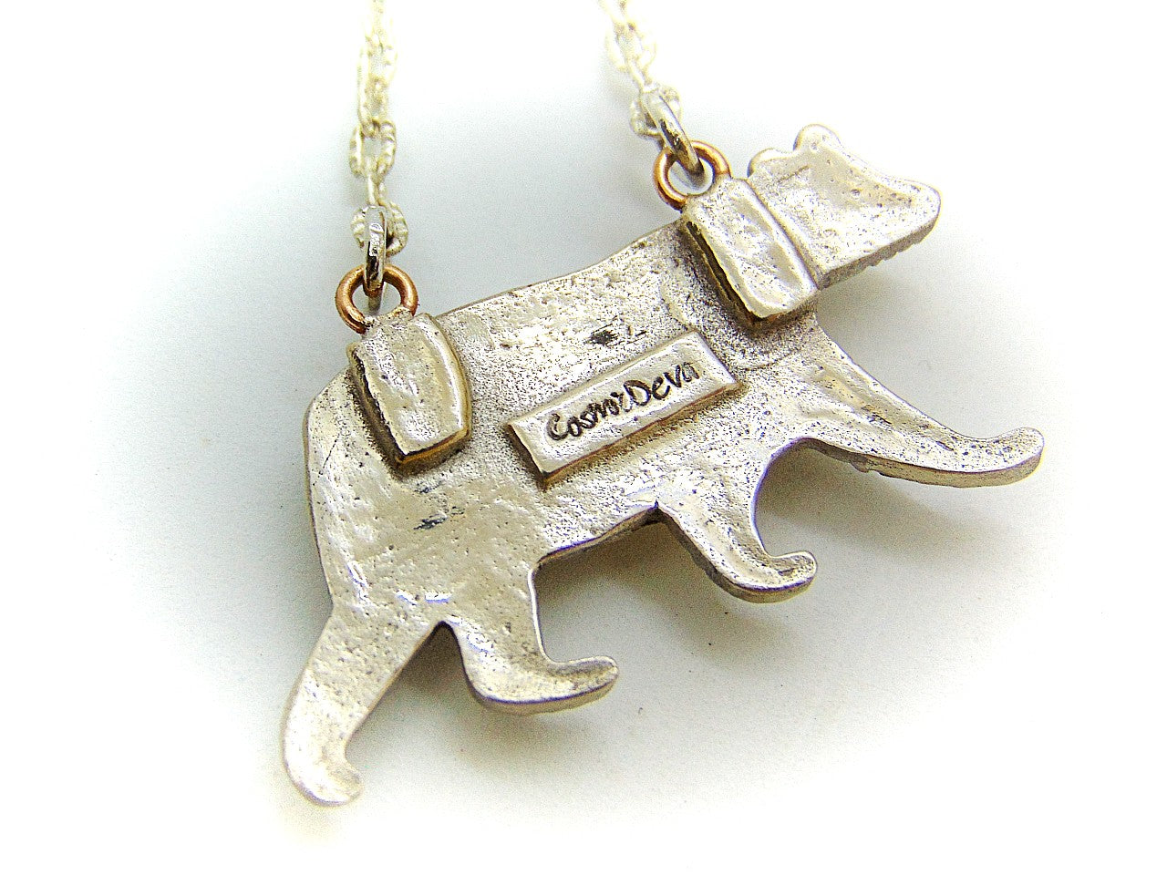 Bring the strength of your spirit animal home with this beautiful handcrafted polar bear pendant! Featuring a 5mm lab-grown blue spinel gemstone and a bronze finish, this necklace is strong and stylish. With a durable adjustable 18-20 inch chain, you can take the comforting power of your spirit animal with you wherever you go!