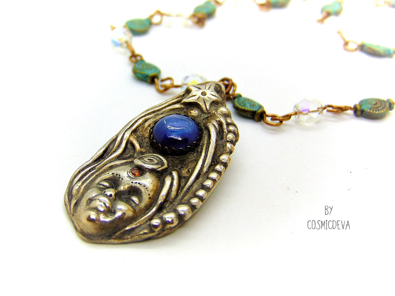 Be inspired with this unique, handmade Goddess Silver Bronze Necklace with a Blue Kyanite gemstone. Its one-of-a-kind design will bring beauty and enchantment to your life! A tiny fire opal adorns the goddess' third eye for an added spark of color and power. Crafted with love, it will be your cherished companion for many years.
