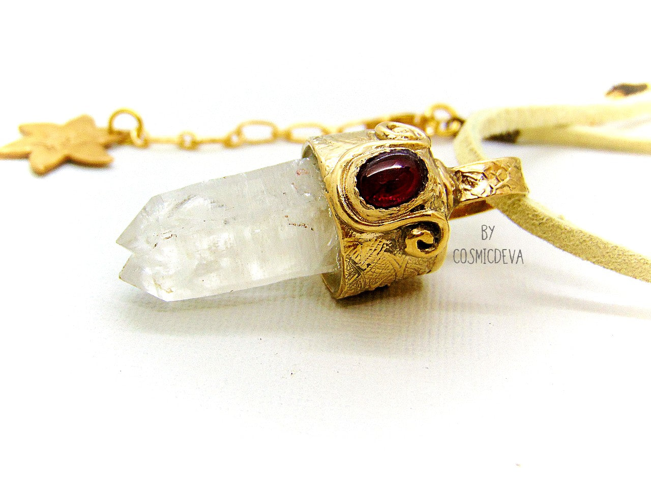 One of a kind completely hand sculptured gold bronze pendant with clear natural twin pointed crystal quartz wand and a lovely red ruby setting. A textured spirit animal dolphin is shown on the backside of the gold bronze pendant. Twin pointed crystals also known as soulmate crystals are two points one body, representing co- in-joined twins or entwined souls. Carry and meditate on a piece of twin pointed quartz to attract your soulmate.