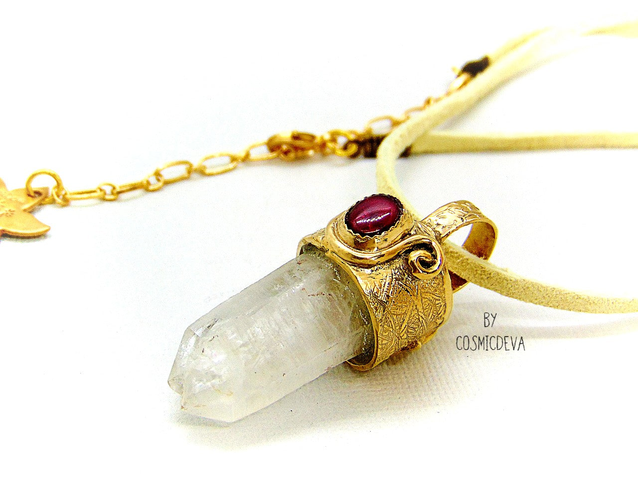 One of a kind completely hand sculptured gold bronze pendant with clear natural twin pointed crystal quartz wand and a lovely red ruby setting. A textured spirit animal dolphin is shown on the backside of the gold bronze pendant. Twin pointed crystals also known as soulmate crystals are two points one body, representing co- in-joined twins or entwined souls. Carry and meditate on a piece of twin pointed quartz to attract your soulmate.