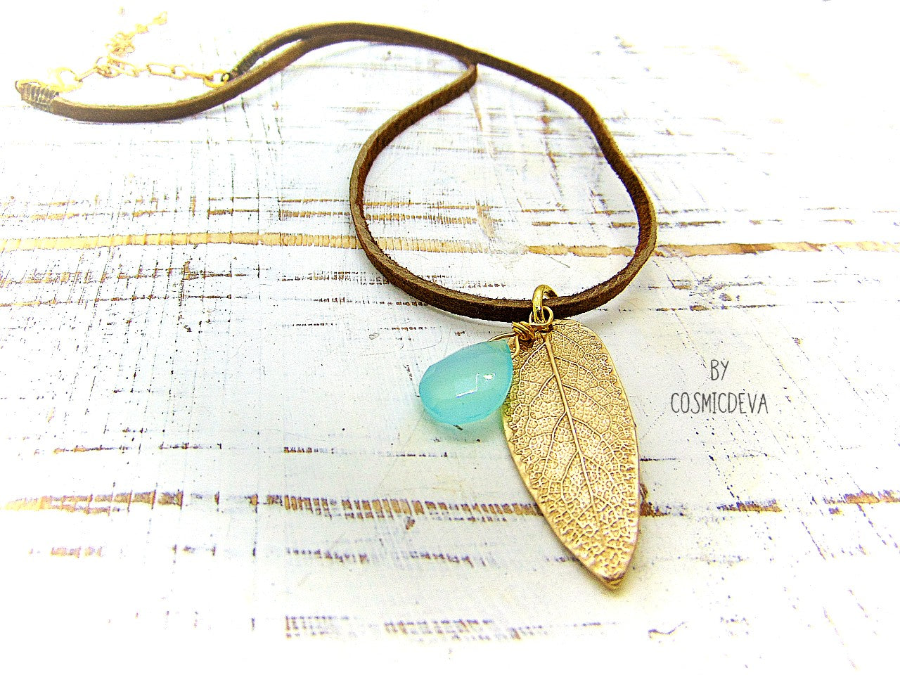 I made this nature inspired sage leaf necklace from a leaf of a sage plant which grows in my yard. As a focal point I added a gorgeous natural aqua blue chalcedony briolette gemstone.  This beautiful organic sage leaf necklace comes with a 18-inch-brown leather cord plus an extension chain and 18K gold plated lobster clasp. 