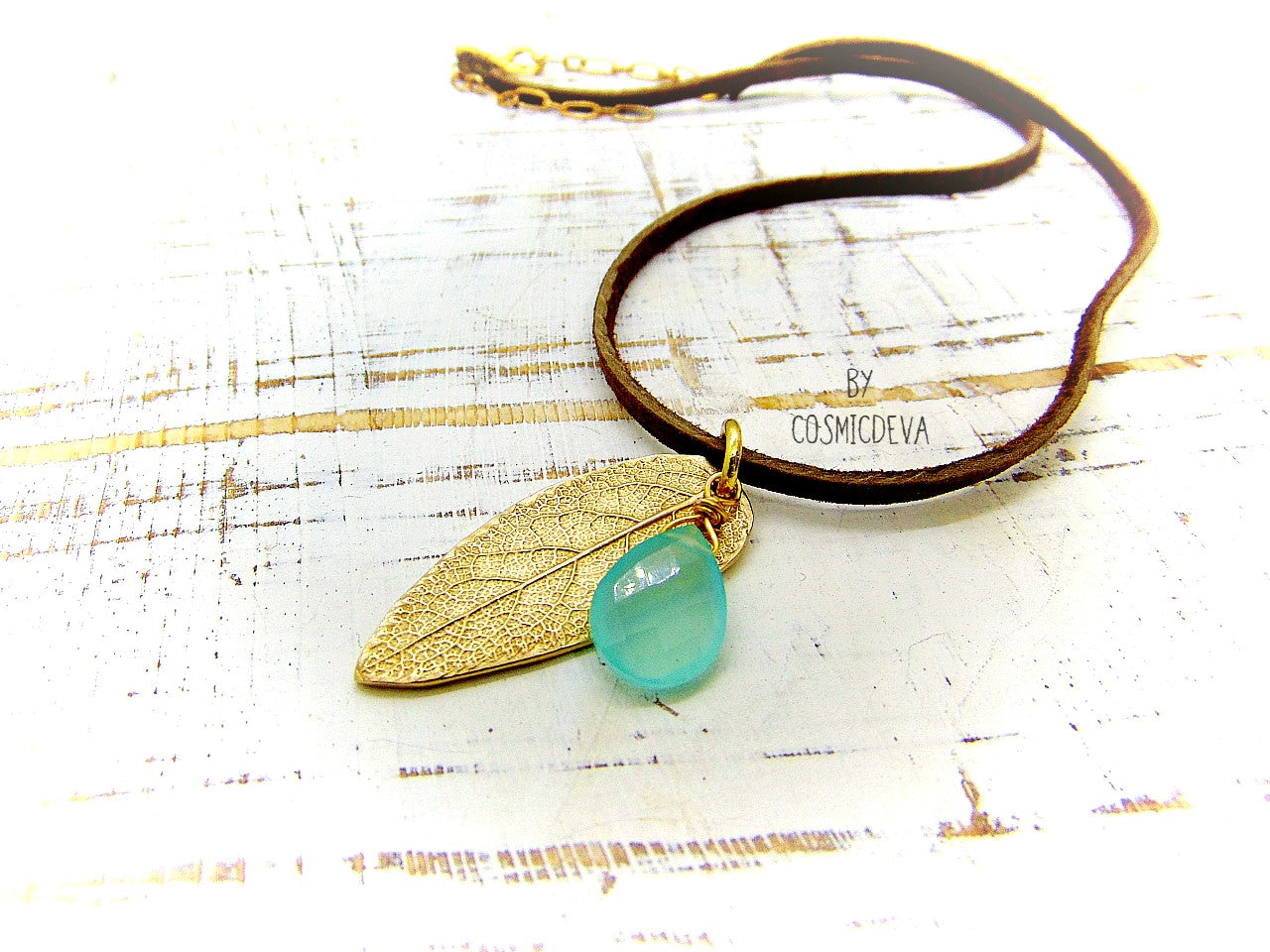 I made this nature inspired sage leaf necklace from a leaf of a sage plant which grows in my yard. As a focal point I added a gorgeous natural aqua blue chalcedony briolette gemstone.  This beautiful organic sage leaf necklace comes with a 18-inch-brown leather cord plus an extension chain and 18K gold plated lobster clasp. 