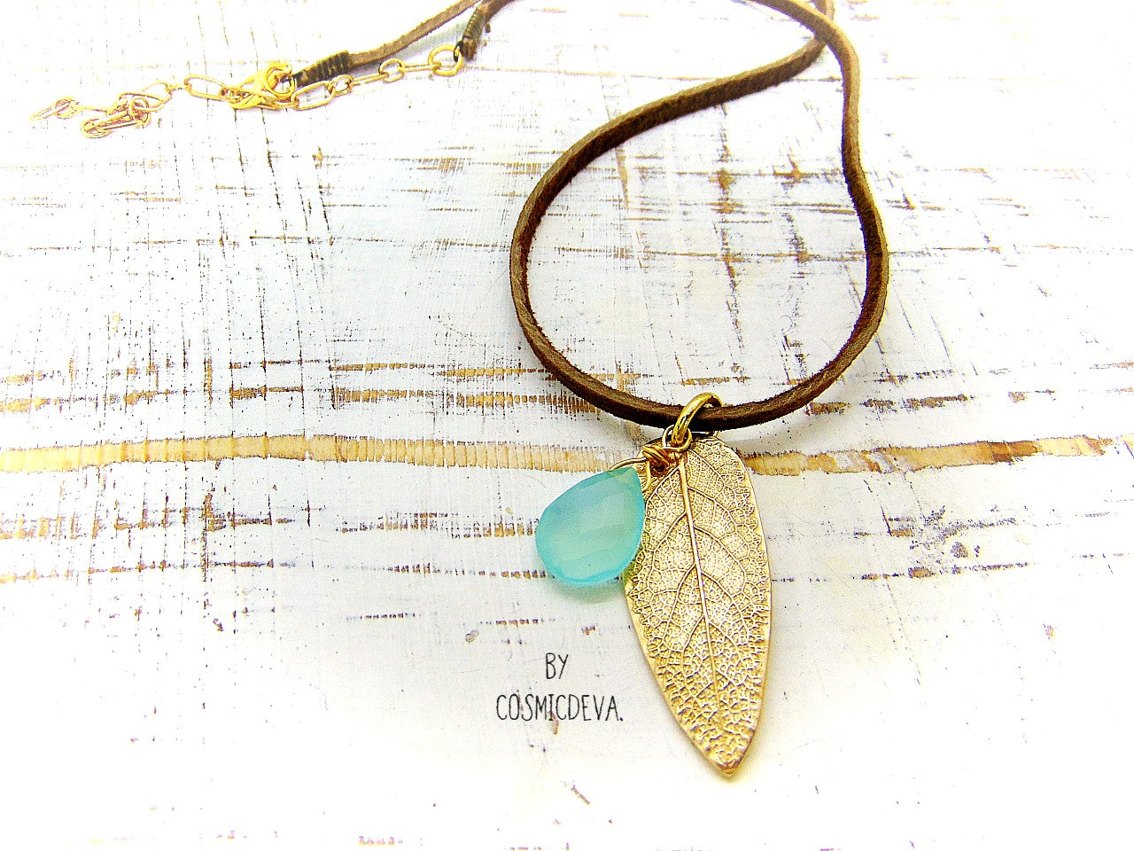 I made this nature inspired sage leaf necklace from a leaf of a sage plant which grows in my yard. As a focal point I added a gorgeous natural aqua blue chalcedony briolette gemstone.  This beautiful organic sage leaf necklace comes with a 18-inch-brown leather cord plus an extension chain and 18K gold plated lobster clasp. 