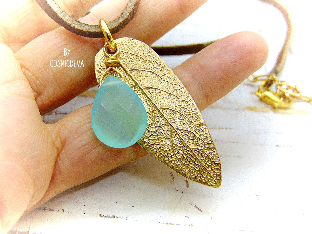 I made this nature inspired sage leaf necklace from a leaf of a sage plant which grows in my yard. As a focal point I added a gorgeous natural aqua blue chalcedony briolette gemstone.  This beautiful organic sage leaf necklace comes with a 18-inch-brown leather cord plus an extension chain and 18K gold plated lobster clasp. 