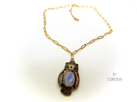 Cute one of a kind complete handcrafted and kiln fired gold bronze spirit animal owl with gorgeous rainbow moonstone bezel setting in the center. The backside of the pendant is also a owl and carries the cosmicdeva logo.