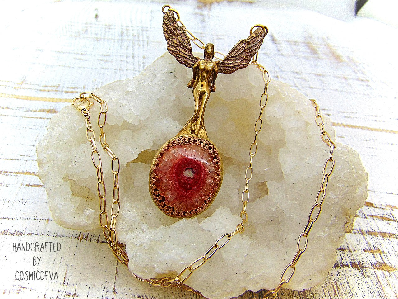 Be divinely inspired wearing this unique Archangel Chamuel pendant necklace. Handcrafted from gold bronze, it features a pink solar quartz bezel setting and is charged with the pink angel light ray of Kamael, the Archangel of peaceful relationships. Energize your spirit and look beautiful 