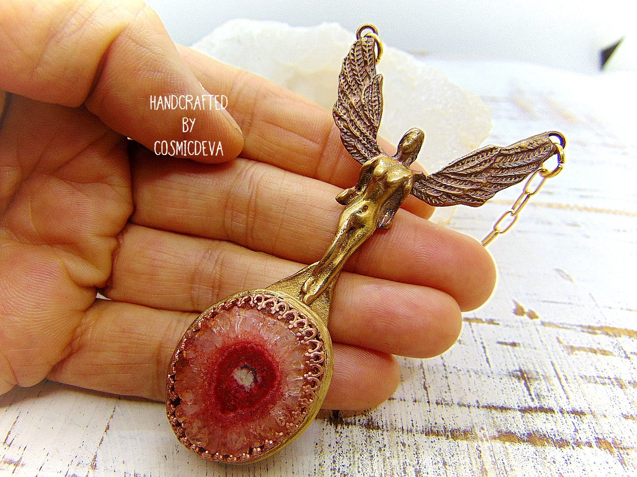 Be divinely inspired wearing this unique Archangel Chamuel pendant necklace. Handcrafted from gold bronze, it features a pink solar quartz bezel setting and is charged with the pink angel light ray of Kamael, the Archangel of peaceful relationships. Energize your spirit and look beautiful 