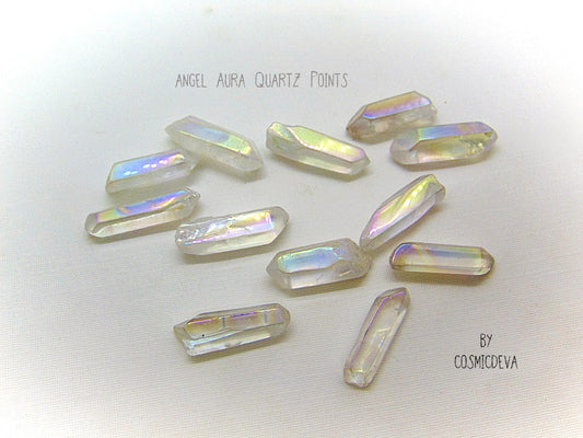 Lovely shimmering iridescence Angel Aura Quartz crystal points.  Angel Aura Quartz is natural clear quartz with an infusion of pure titanium, silver and gold. The Natural Clear Quartz Point is placed in a pressurized chamber at high temperature and exposed to pure vaporized precious metal. 
